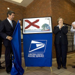 Officials unveiling the Alabama stamp are (left to right) Birmingham Postmaster Samuel Jaudon, Gov. Bob Riley, Montgomery Postmaster Teresa Welch, and Lee Sentell, director of Alabama Tourism. Courtesy - State of Alabama (Governor